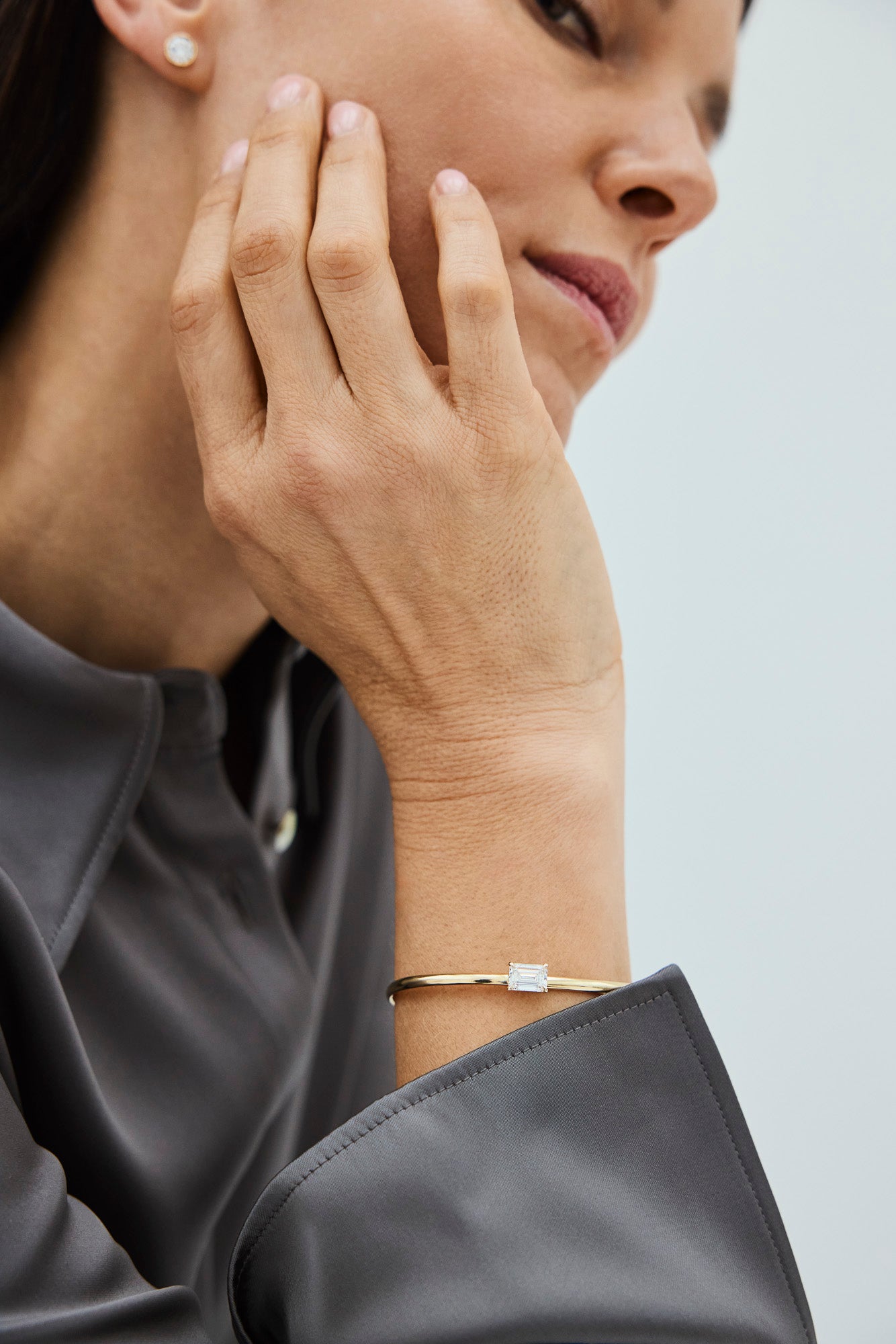 Woman wearing a bracelet with square lab-grown diamonds
